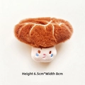 Macro shot of cute plush mushroom accessory featuring a friendly face and soft brown texture - Flower Mushroom