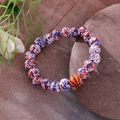 Beaded bracelet with blue speckled beads and an orange basketball charm on a stone - Red White Blue Basketball Bracelet