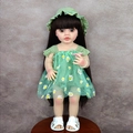 Reborn baby doll with long dark hair wearing a green daisy tulle dress and hat - Green Daisy Dress Brown Hair / Doll Clothes (Outfit Only)