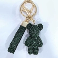 Detail of dark green rhinestone bear keychain with matching glitter strap and gold hardware - Dark Green