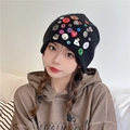 Black knit beanie for women featuring colorful button accents and red heart detail - One Size / Black