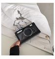 Black glossy camera-shaped crossbody bag with polka dot ribbon and silver chain strap - Classic Patent Leather / Black