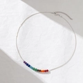 Detail of thin silver chain necklace with eleven vibrant rainbow crystal beads and lobster clasp - Necklace / Silver