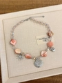 Detail of pink layered necklace featuring silver seashell charms and crystal beads - Pink Shell Style Z-693