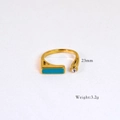 Macro detail of gold 14k ring with rectangular turquoise and clear crystal stones - Rectangular Turquoise Gemstone Style