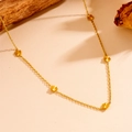 Minimalist gold necklace featuring five sunburst flower pendants on a delicate chain - Five-Flower (H512)