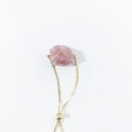 Close-up of raw pink crystal stone on adjustable gold box chain bracelet - Strawberry Quartz