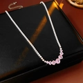 Close-up of elegant silver necklace with pink round gems on black leather box - Silver-Pink