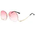 Frameless oversized sunglasses featuring pink gradient lenses and elegant gold metal temples - Gradient Pink