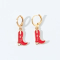 Detail of red enamel western cowboy boot earrings with golden star accent on white background - Hoop Earrings / Red