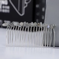 Macro shot of silver hair comb with handmade blue natural stone crystal wire wrapping - Labradorite + 20-Tooth Silver Comb