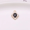 Gold-plated sunflower pendant with black oval gemstone and sparkling zircon halo - Black