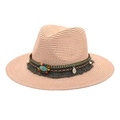 Detail of light pink woven straw fedora featuring bohemian ethnic beadwork and tassels - Light Pink