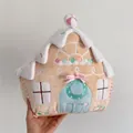 Gingerbread house plush pillow with white snow top and festive embroidery details - Nordic Pink House
