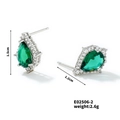 Detailed view of silver teardrop emerald earrings with white diamond halo and size specs - Silver