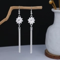 Detail of silver bohemian floral earrings with long tassels on a stylized branch - Bright Silver Floral Tassel Pair Style (E4199)