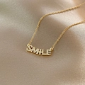 Elegant gold titanium smile necklace with sparkling white pavé crystals on champagne satin - Titanium Steel Gold Style (X582)