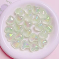 Macro shot of shimmering heart-shaped resin beads for DIY jewelry in green iridescent finish - 1 Bead / Light Green