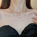 Detail of a gold layered choker necklace featuring elegant small pink crystal embellishments - Gold Layered Pink Round Necklace