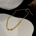 Minimalist gold titanium steel square pendant necklace on a mirror with artistic shadows - Small Square Bead Necklace / Gold