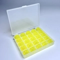 25 Yellow Bobbins In A 25-compartment Box / Shuttle Core Storage Box