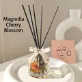 Magnolia Cherry Blossom reed diffuser set with glass bottle, dried flowers and black sticks - 100ml / Magnolia & Cherry Blossom