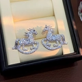 Elegant rocking horse stud earrings featuring sparkling white zircon stones in silver tone - E7944 Silver Pin-Silver White