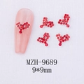 Detail of heart-shaped 9x9mm red nail gemstone accessory on a pink mannequin finger - Heart Style (9689)