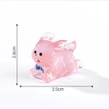 Pink translucent rabbit figurine with blue bow, dimensions 2.8cm x 3.5cm - Luminous Rose Pink