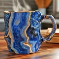 Blue mineral crystal agate mug with gold rim finish on a rustic wooden table - Dark Blue Wave