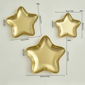 Three-piece set of minimalist star-shaped iron trays in matte gold finish with size specs - Gold