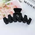 Matte black wavy shark hair claw clip for women in a minimalist large curved design - Black