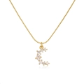 Detailed macro shot of 18K gold plated brass crescent moon pendant with zircons - Gold Color Irregular Moon