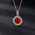 Rose gold pendant necklace featuring a round red gemstone surrounded by white crystals - TZ-22 Style