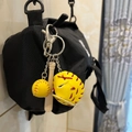 Three-piece baseball keychain set featuring yellow ball and glove on black bag - 2CM Yellow Ball Long Bat Yellow Glove with Red Strap