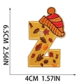 Detailed size view of letter Z alphabet embroidery patch with autumn leaf and knit hat design - Letter Z