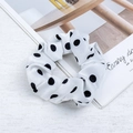 Satin polka dot scrunchie in white with black dots for elegant hair styling - White