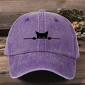 Lilac washed denim baseball cap featuring a black peeking cat embroidery on a wooden table - One Size / Lilac Purple