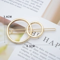 Minimalist golden alloy hair clip with elegant interlocking double rings design, 6.3cm long - Double Circle Gold