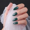 Macro detail of glossy dark green stiletto nails with elegant white lace photography prop - Glossy Dark Green (JJL-13)