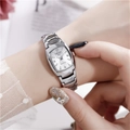 Close-up of elegant tonneau-shaped women quartz watch with silver steel band on wrist - Square Dial Women's Style / Silver Band White Square Dial