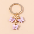 Lavender acrylic butterfly keychain with golden rings and sparkling marble finish - Purple Texture (YZ172zise)