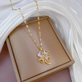 Elegante collana con ciondolo a quadrifoglio dorato e zirconi su catena a cuori - Oro (E401 Catena in Acciaio Inossidabile Ciondolo in Rame)