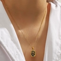 Gold tulip relief pendant necklace with black oval medallion on a thin steel chain - Tulip (DJN011GL)