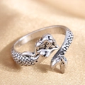 Macro detail of vintage silver mermaid ring showing scale texture and fine engraving - Retro Silver Mermaid