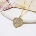 Golden heart pendant necklace with shimmering zircon stones on a decorative background - Heart Pendant Necklace (ZYN-DMK536G)