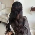 Elegant dark brown velvet bow hair clip shown on model for a vintage aesthetic style - Twist Clip / Brown