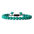 Detail of woven turquoise stone bracelet with black adjustable pull cord on white background - Turquoise