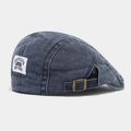 Detail view of the adjustable metal buckle and Brooklyn patch on a retro canvas beret - Adjustable / Navy Blue