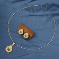 Detailed view of gold stainless steel necklace and earrings set with twisted knot design - E6107-6/Gold Stainless Steel Multi-loop Knot